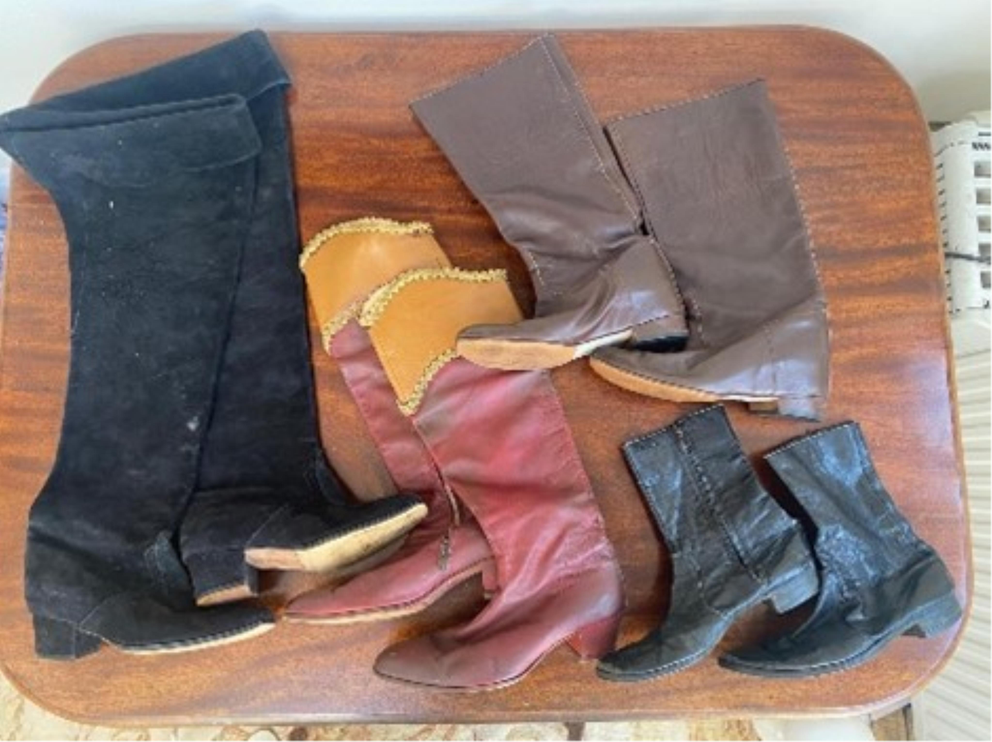 Four pairs of men’s knee length period military boots, one black and the other in black suede. Large sizes